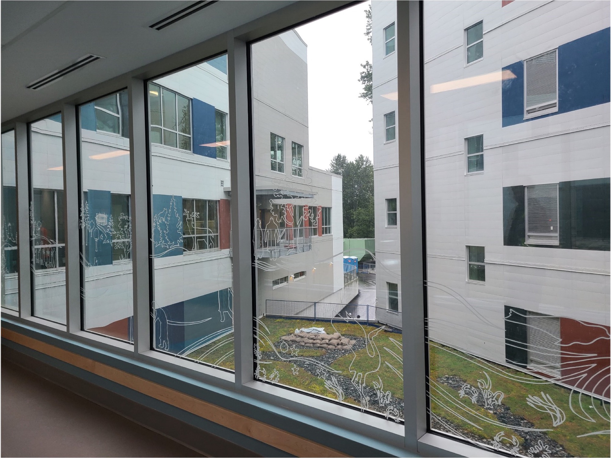 A run of windows looking onto the courtyard