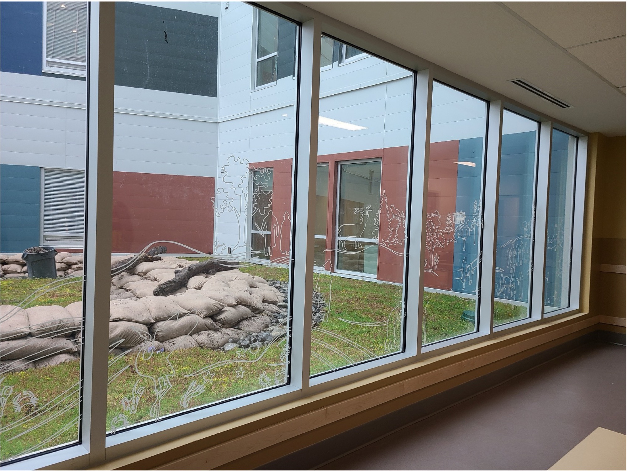 Line art continuing along the three-floor window wall