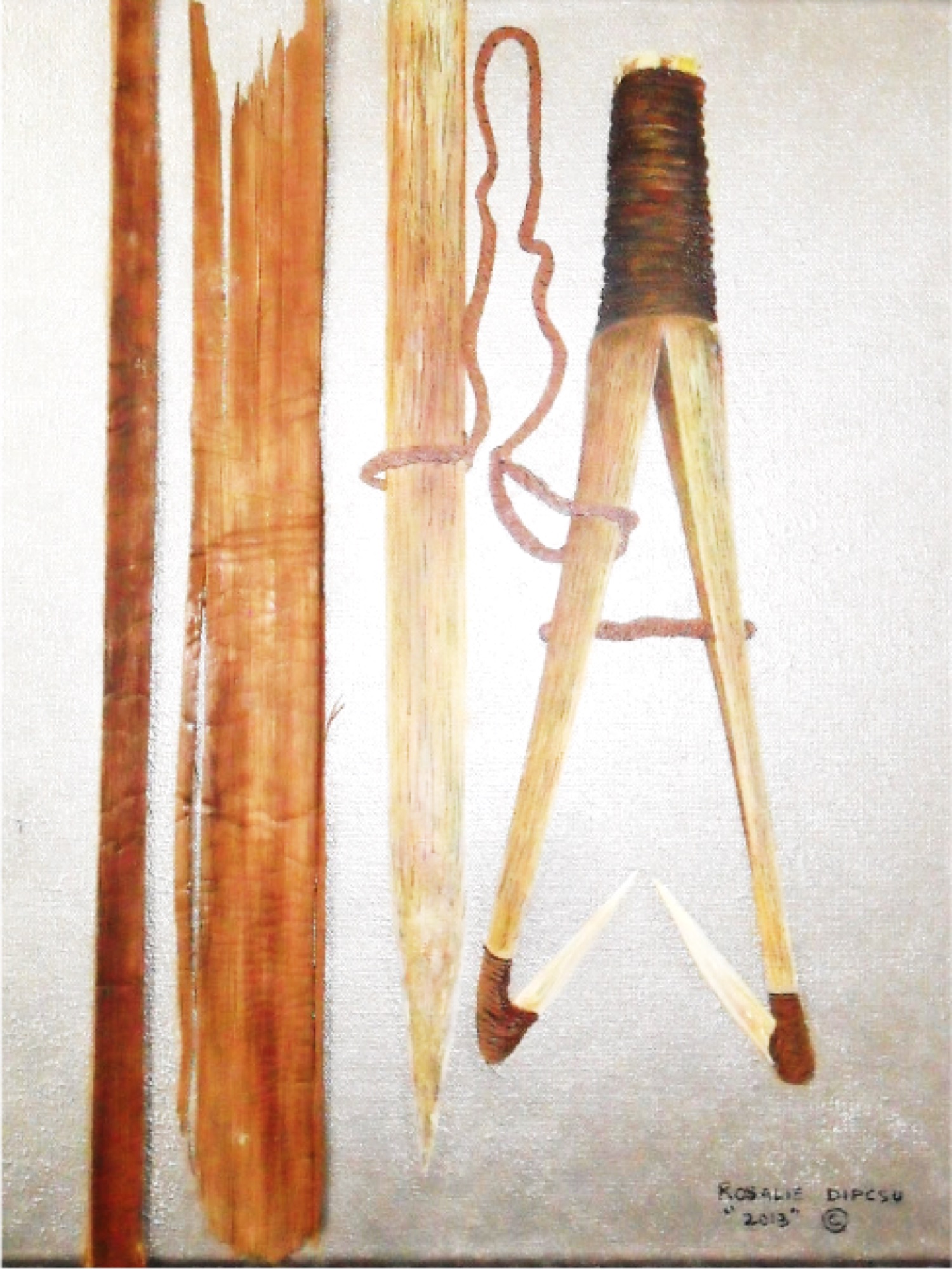 Inner cedar bark, a pointed stick, and a wrapped wooden implement